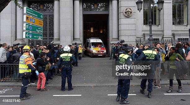 Ambulances carry injured people after fire broke out in a part under construction at Bank of Spain premises in Madrid, Spain on November 03, 2014....