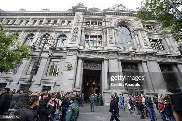 Police stand in front of the entrance of Bank of Spain premises after fire broke out in a part under construction in Madrid, Spain on November 03,...