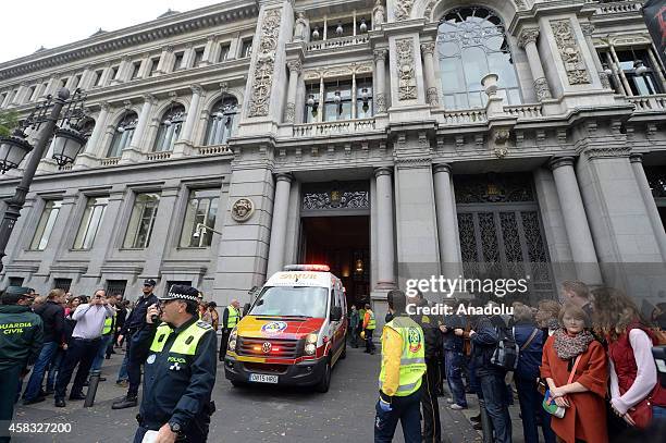 Ambulances carry injured people after fire broke out in a part under construction at Bank of Spain premises in Madrid, Spain on November 03, 2014....