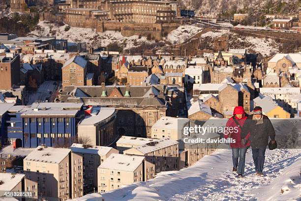 snow walk - edinburgh winter stock pictures, royalty-free photos & images