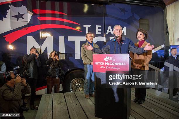 Sen. Mitch McConnell speaks during his campaign event as U.S. Sen. Rand Paul and McConnell's wife Elaine Chao look on and at Bowman Field November 3,...