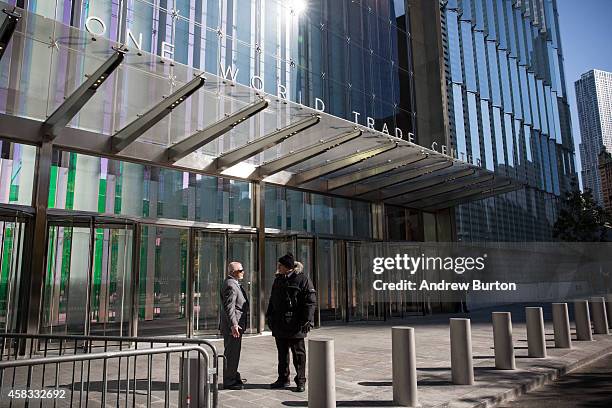 Security guards stand outside One World Trade Center, which opened today, on November 3, 2014 in New York City. The skyscraper is 104 stories tall...