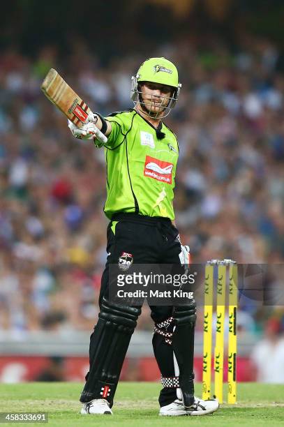 David Warner of the Thunder acknowledges the crowd after scoring a half century during the Big Bash League match between the Sydney Sixers and Sydney...