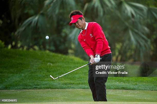 Hiroyuki Fujita of Japan chips into the 17th green during the Royal Trophy Europe vs Asia Golf Championship at Dragon Lake Golf Club on December 21,...