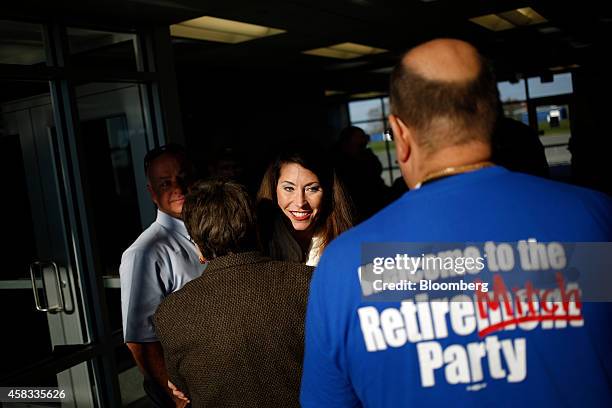 Alison Lundergan Grimes, Democratic candidate for the U.S. Senate, center, greets supporters at a campaign stop at the Lake Cumberland Regional...