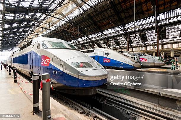 high speed tgv trains parked at gare de lyon station - railway station stock pictures, royalty-free photos & images