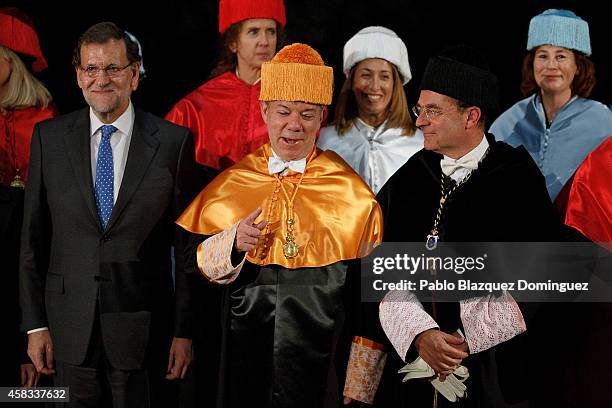 Spanish Prime Minister Mariano Rajoy, Colombia's President Juan Manuel Santos, University rector Eduardo Nolla Blanco pose for a picture during...