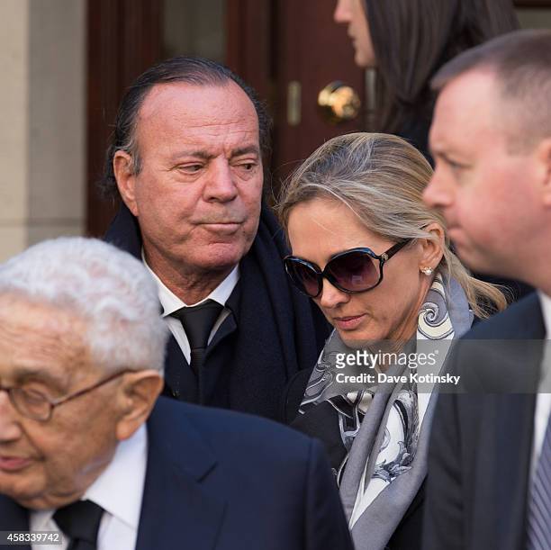 Julio Iglesias and wife Miranda Rijnsburger depart the funeral of fashion designer Oscar De La Renta at St. Ignatius Of Loyola on November 3, 2014 in...