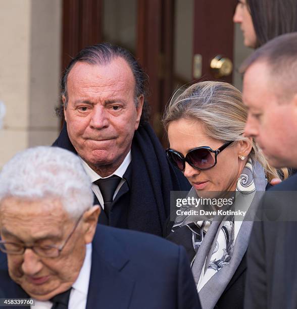 Julio Iglesias and wife Miranda Rijnsburger depart the funeral of fashion designer Oscar De La Renta at St. Ignatius Of Loyola on November 3, 2014 in...