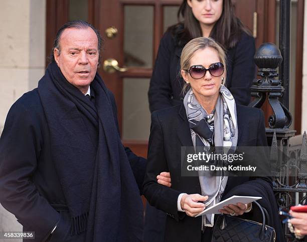 Julio Iglesias and wife Miranda Rijnsburger depart the funeral of fashion designer Oscar De La Renta at St. Ignatius Of Loyola on November 3, 2014 in...