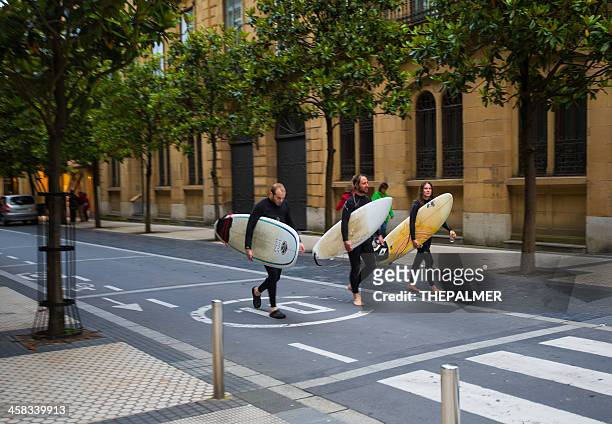surfers in the city - city to surf stock pictures, royalty-free photos & images