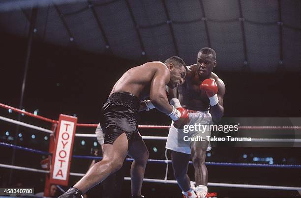 Heavyweight Title: James Buster Douglas in action, throwing punch vs Mike Tyson at Tokyo Dome.Tyson is defeated by Douglas by 10th round knockout for...