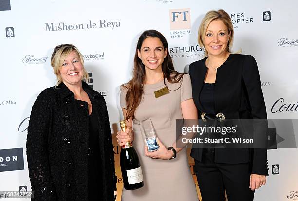 Of Walpole Michelle Emmerson and Member of Swarovski Executive Board Nadja Swarovski pose with the winner of the Emerging British Luxury Brand Award...