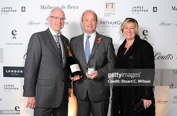 Of Walpole Michelle Emmerson and Managing Director of Laurent-Perrier David Hesketh pose in front of the winners boards with the British Luxury Brand...
