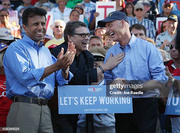 Lousiana Governor Bobby Jindal and Texas Governor Rick Perry campaign with Florida Governor Rick Scott at The Villages retirement community on...