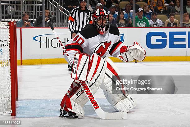 Scott Clemmensen of the New Jersey Devils defends the net against the Pittsburgh Penguins at Consol Energy Center on October 28, 2014 in Pittsburgh,...