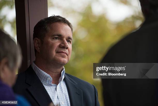 Representative Bruce Braley, the Democratic nominee for the U.S. Senate, listens as Senator Tom Harkin, Iowa's outgoing Democratic senator, speaks...