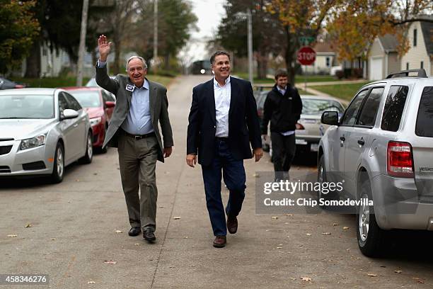 Democratic U.S. Senate candidate Rep. Bruce Braley and retiring Sen. Tom Harkin arrive at a canvassing kickoff November 3, 2014 in Iowa City, Iowa....
