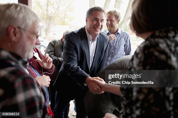 Democratic U.S. Senate candidate Rep. Bruce Braley thanks volunteers before they set out to canvass the surrounding neighborhood November 3, 2014 in...