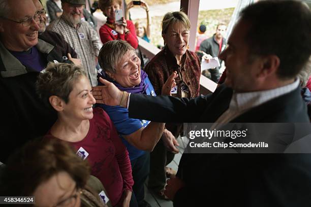 Democratic U.S. Senate candidate Rep. Bruce Braley thanks volunteers before they set out to canvass the surrounding neighborhood November 3, 2014 in...