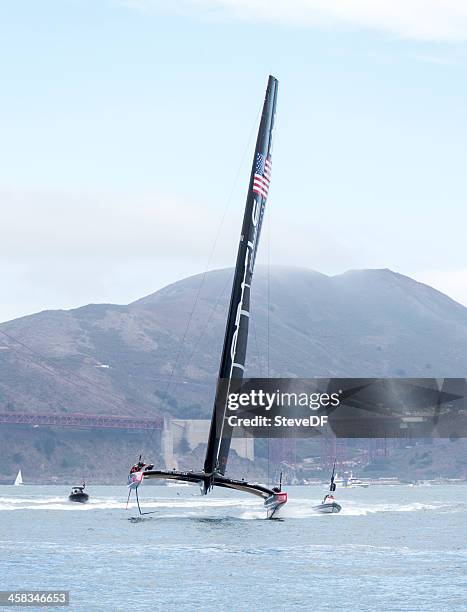 team oracle's 72 foot america's cup catamaran out training - racing catamaran stock pictures, royalty-free photos & images