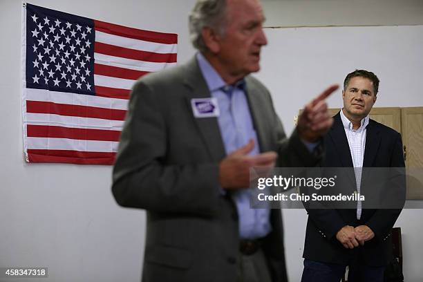 Democratic U.S. Senate candidate Rep. Bruce Braley listens to retiring Sen. Tom Harkin thank volunteers at the Lynn Count Democratic Headquarters the...