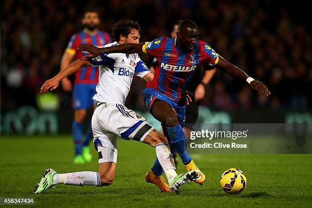 Yannick Bolasie of Crystal Palace is tackled by Will Buckley of Sunderland during the Barclays Premier League match between Crystal Palace and...