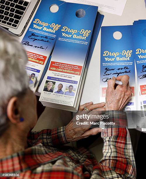 Volunteer Rose Protextor of Denver, Colorado writes personalized notes on door hangers at a Democratic field office for U.S. Sen. Mark Udall on...