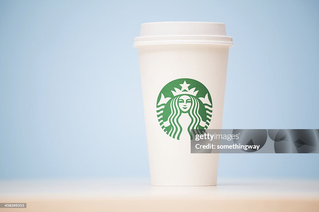 Grande Starbucks to go cup on table