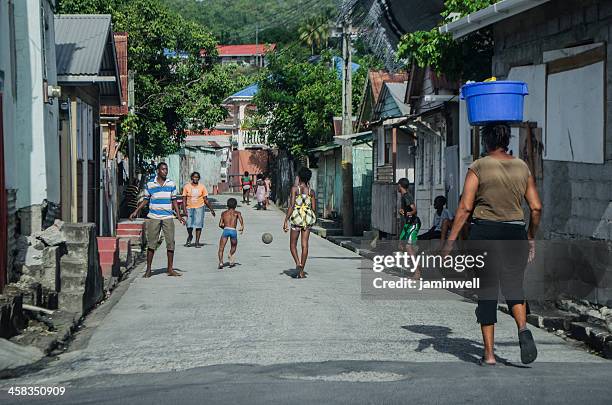 lively street scene of anse-la-raye - washing tub stockfoto's en -beelden