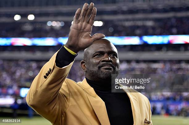 Former New York Giants player Lawrence Taylor waves to the crowd prior to their game against the Indianapolis Colts at MetLife Stadium on November 3,...