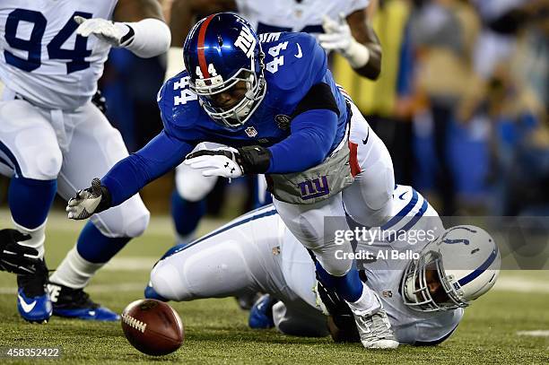 Andre Williams of the New York Giants fumbles the ball in the first quarter against the Indianapolis Colts during their game at MetLife Stadium on...