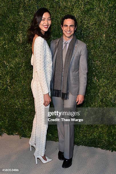 Model Liu Wen and designer Zac Posen attend the 11th annual CFDA/Vogue Fashion Fund Awards at Spring Studios on November 3, 2014 in New York City.