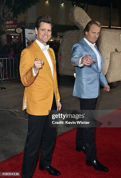 Actors Jim Carrey and Jeff Daniels attend the premiere of Universal Pictures and Red Granite Pictures' "Dumb And Dumber To" on November 3, 2014 in...