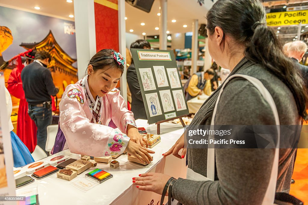 Making a traditional postcard on the Korean stand...