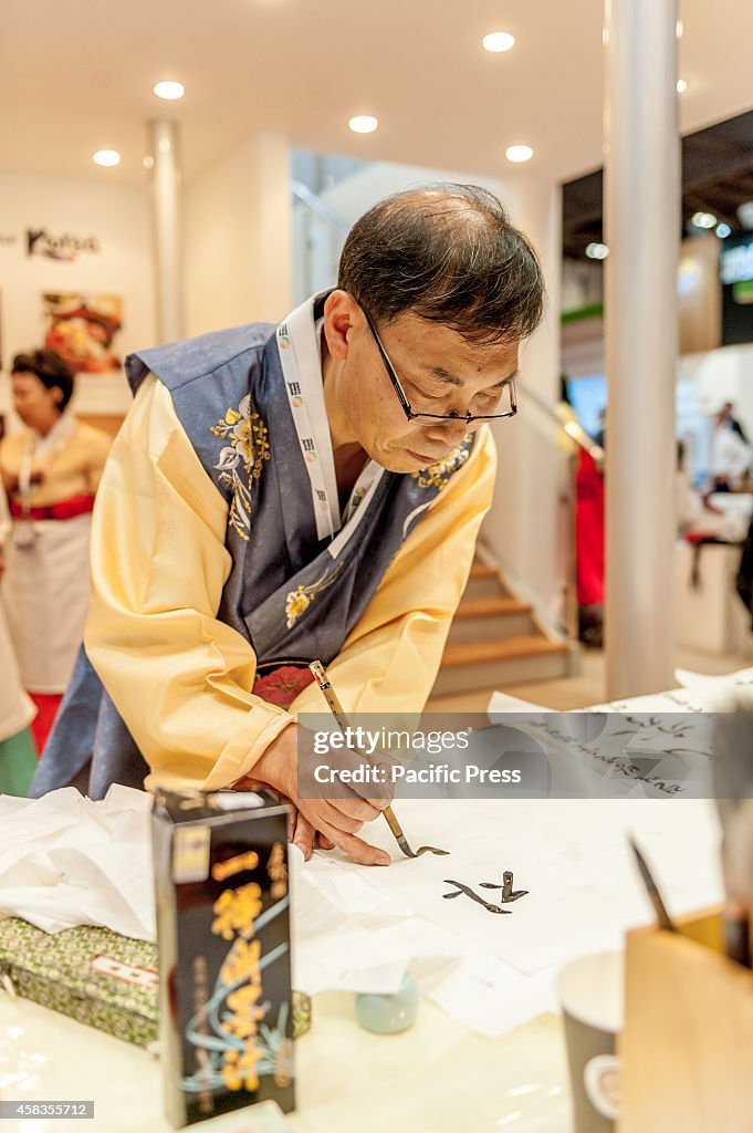 Demonstrating the art of Hangul and Hanja, or Korean...