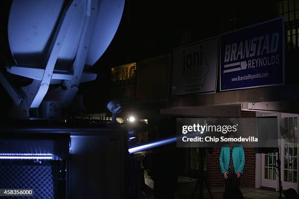 Republican U.S. Senate candidate Joni Ernst is interviewed on Fox News via a live satellite link outside the Alpha Gamma Rho fraternity house on the...