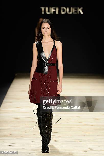 Model walks the runway at the Tufi Duek fashion show during Sao Paulo Fashion Week Winter 2015 at Parque Candido Portinari on November 3, 2014 in Sao...