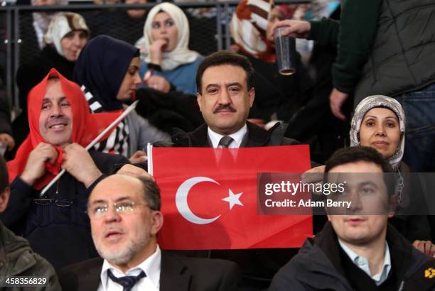 Supporters of Turkish Prime Minister Recep Tayyip Erdogan attend a rally at Tempodrom hall on February 4, 2014 in Berlin, Germany. Turkey will soon...