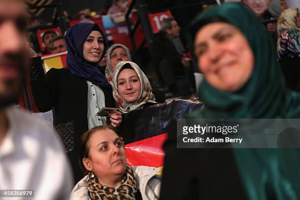Supporters of Turkish Prime Minister Recep Tayyip Erdogan attend a rally at Tempodrom hall on February 4, 2014 in Berlin, Germany. Turkey will soon...