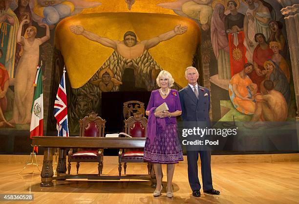 Prince Charles, Prince of Wales and Camilla, Duchess of Cornwall pose in front of a Diego Rivera mural after signing the visitor's book at the launch...