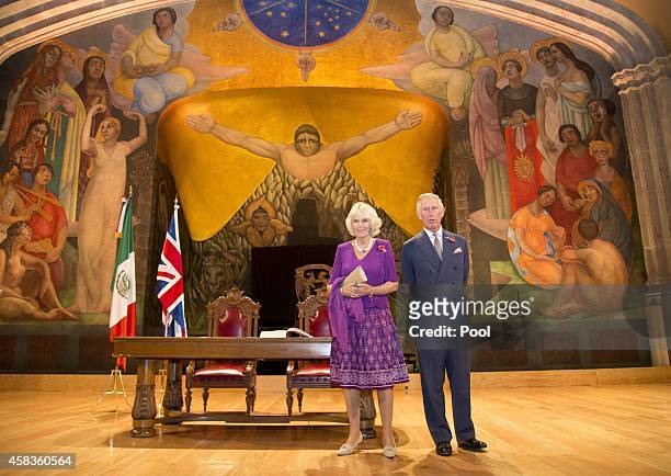 Prince Charles, Prince of Wales and Camilla, Duchess of Cornwall pose in front of a Diego Rivera mural after signing the visitor's book at the launch...