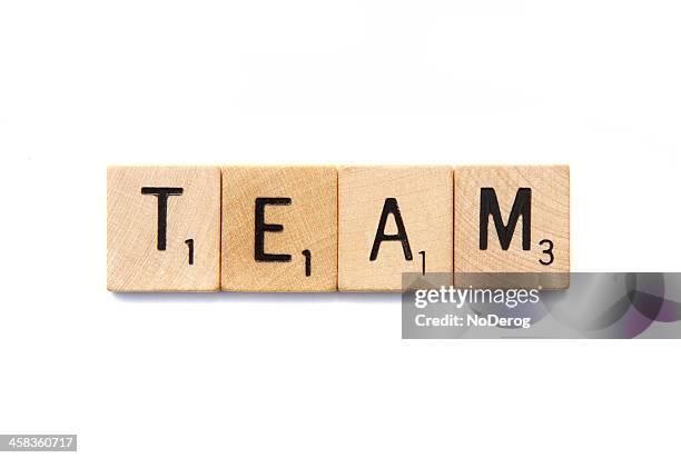 team spelled in scrabble letter tiles - scrabble stock pictures, royalty-free photos & images