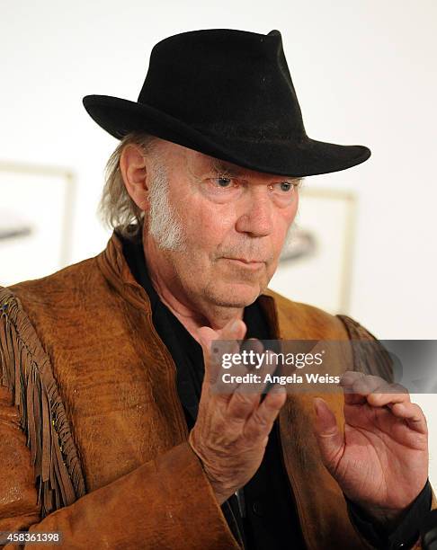 Musician Neil Young attends his opening night reception for "Special Deluxe" Art Exhibition at Robert Berman Gallery on November 3, 2014 in Santa...