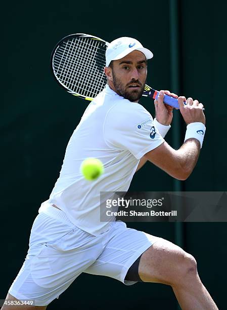 Steve Johnson of The United States plays a backhand during the Men's Singles third round match against Grigor Dimitrov of Bulgaria on day six of the...