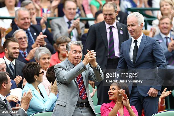 Manuel Santana is announced to the crowed on day six of the Wimbledon Lawn Tennis Championships at the All England Lawn Tennis and Croquet Club on...
