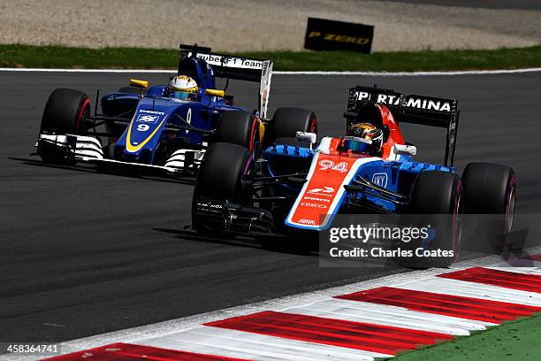 Pascal Wehrlein of Germany driving the Manor Racing MRT-Mercedes MRT05 Mercedes PU106C Hybrid turbo on track ahead of Marcus Ericsson of Sweden...