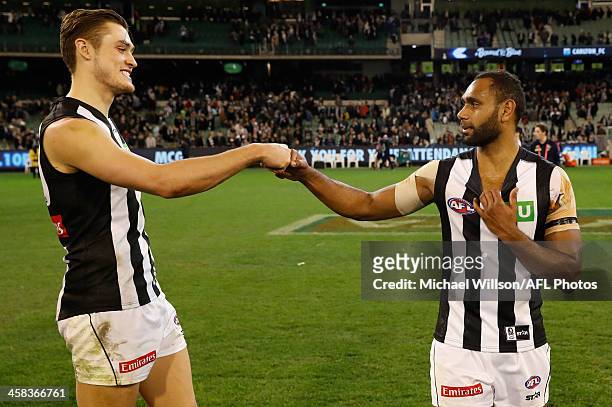 Darcy Moore and Travis Varcoe of the Magpies celebrate during the 2016 AFL Round 15 match between the Carlton Blues and the Collingwood Magpies at...