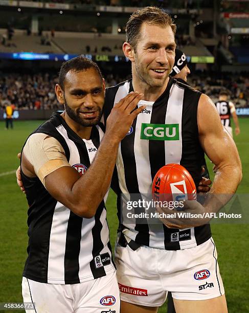 Travis Varcoe and Travis Cloke of the Magpies celebrate during the 2016 AFL Round 15 match between the Carlton Blues and the Collingwood Magpies at...