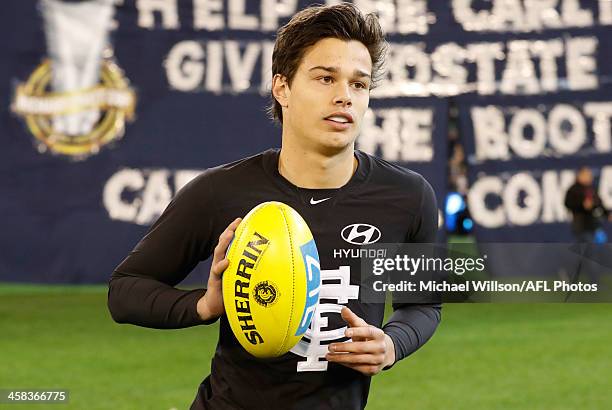 Debutant, Jack Silvagni of the Blues runs through the banner during the 2016 AFL Round 15 match between the Carlton Blues and the Collingwood Magpies...